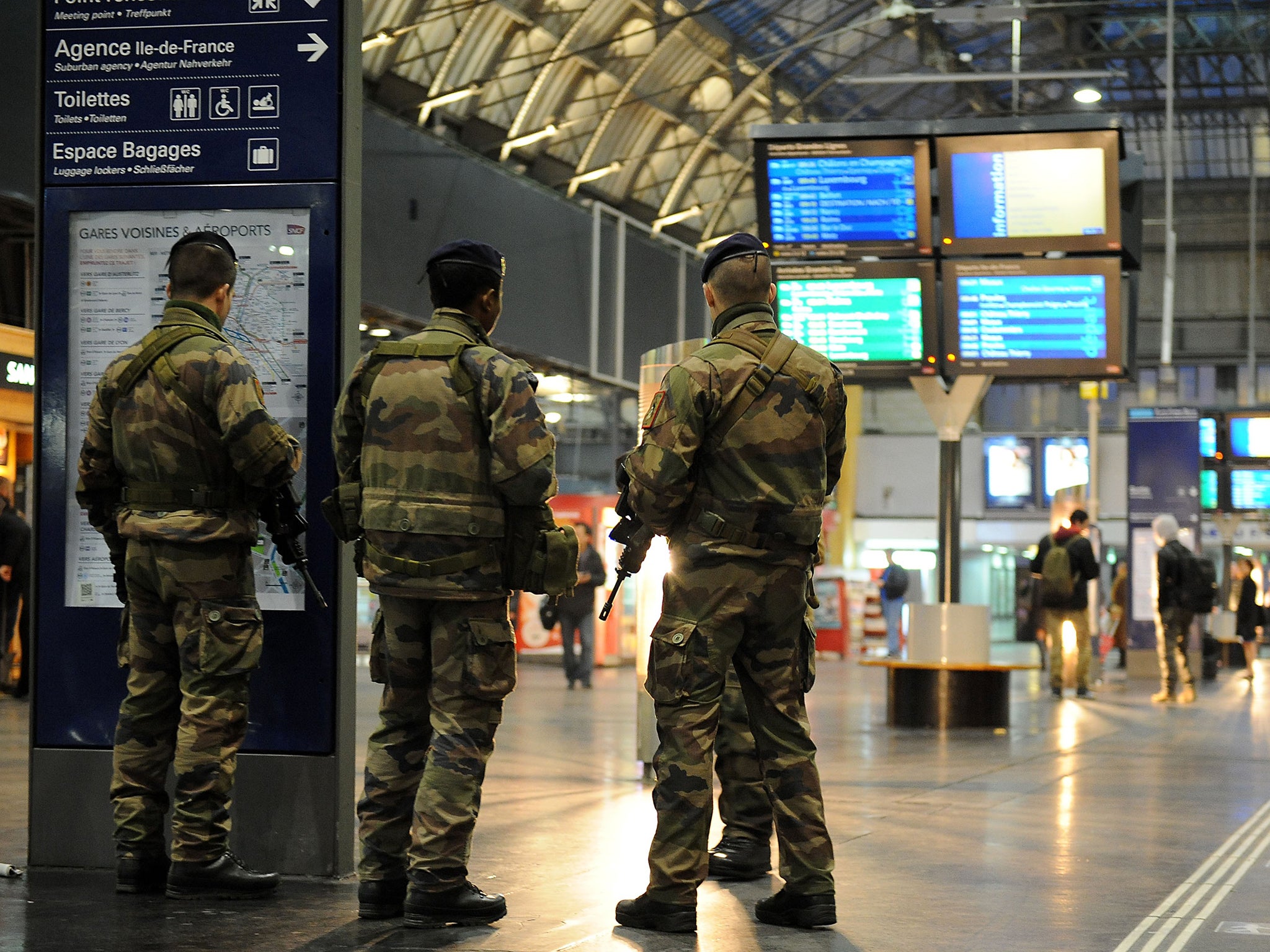 Military personnel patrol the Gare de l’Est railway station in Paris yesterday