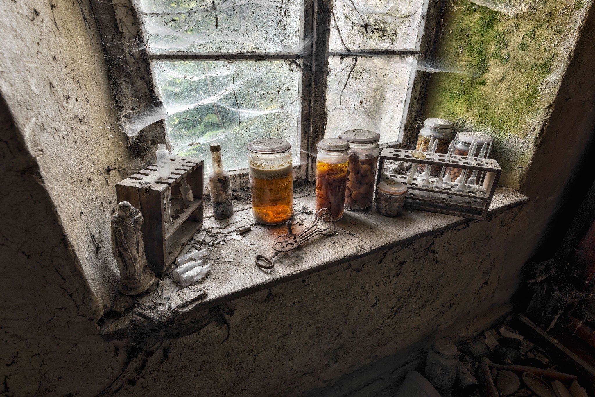 This image was taken in a disused house in Luxembourg in 2013. Inside the browning jars are cherries; the entire room was filled with them