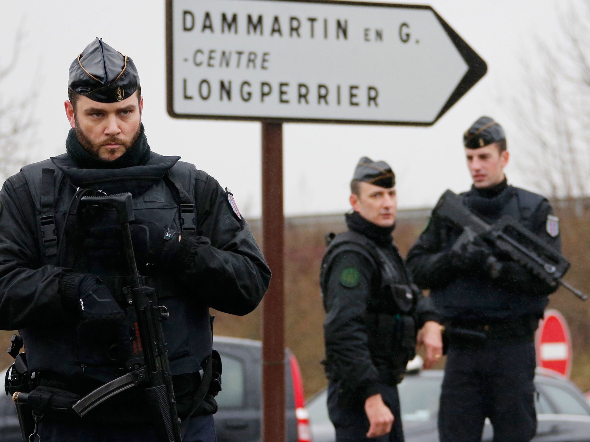 French gendarmes secure the roundabout near the scene of a hostage taking at an industrial zone in Dammartin-en-Goele, northeast of Paris