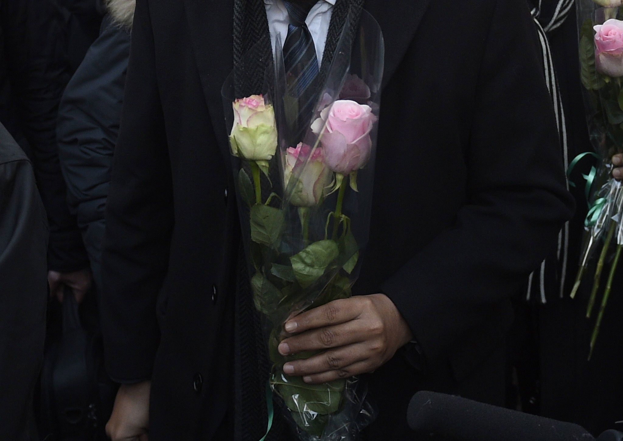The Imam of the Mosque in Drancy and president of the French associtaion of Imam's Hassen Chalghoumi lays a floral tribute