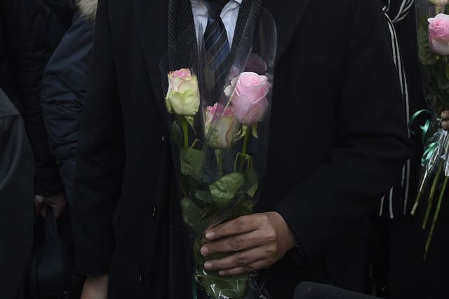 The Imam of the Mosque in Drancy and president of the French associtaion of Imam's Hassen Chalghoumi lays a floral tribute