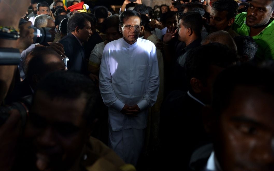 Sri Lanka's newly-elected president Maithripala Sirisena leaves after being sworn in at Independence Square in Colombo