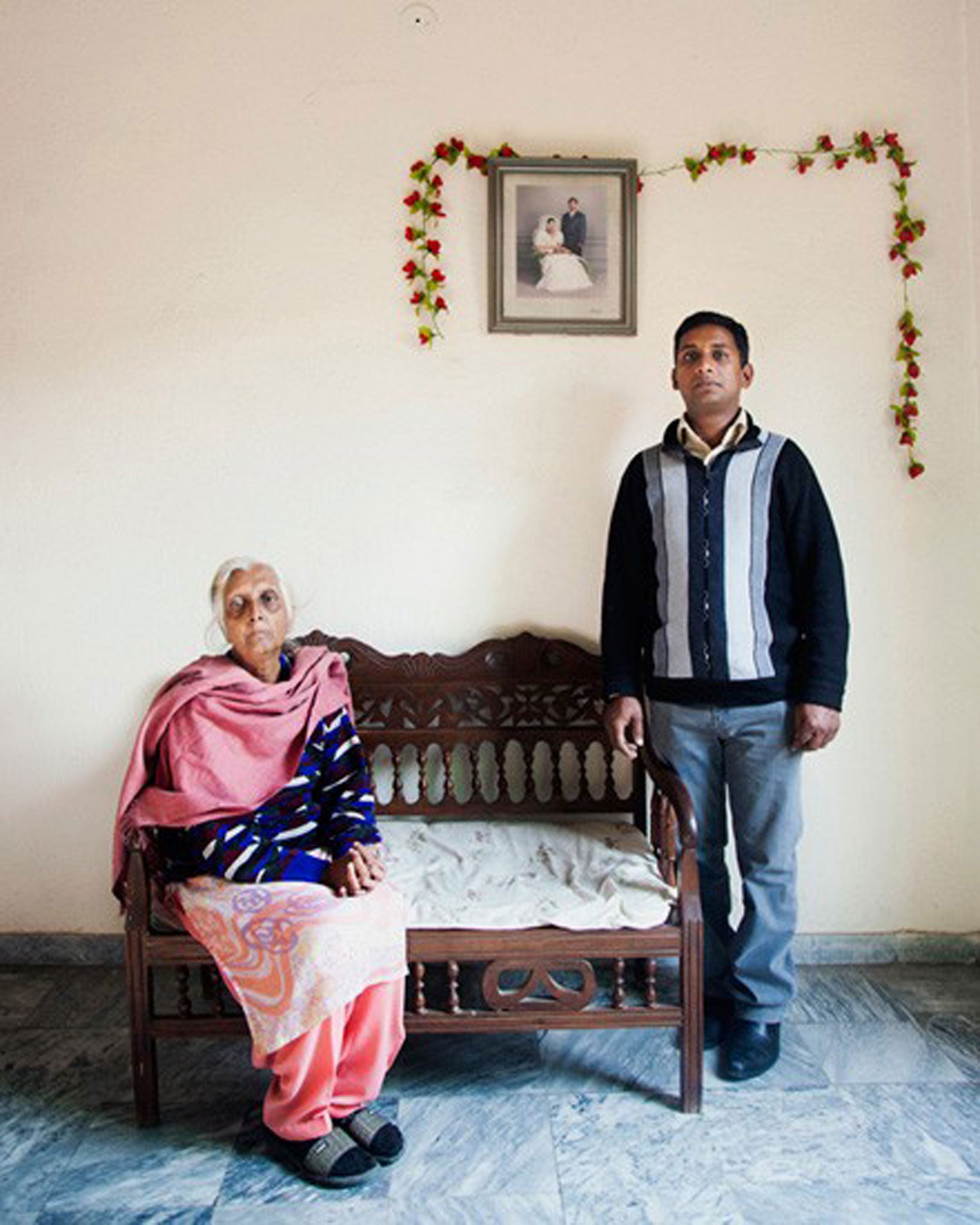Sylvia Henry Pershaad and her son Arif at home in Lahore. Syvlia's youngest son, Ubeid, has been on death row for nine years