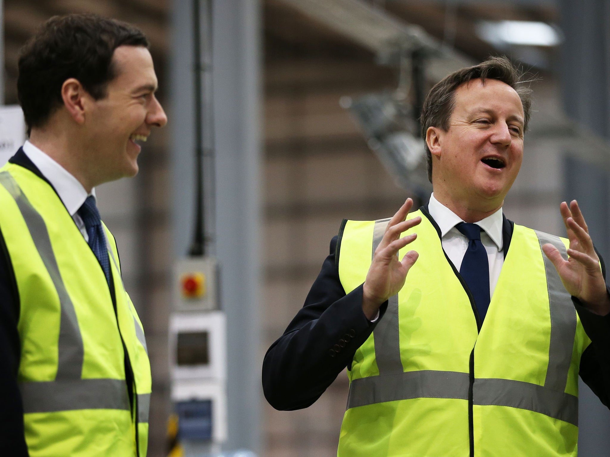 George Osborne (left) and David Cameron visiting Warrington; his office says he is too busy for the debate