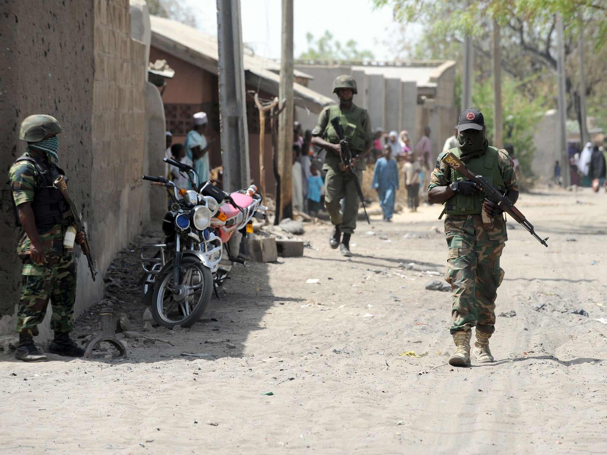 Soldiers walking in the street in the remote northeast town of Baga, Borno State