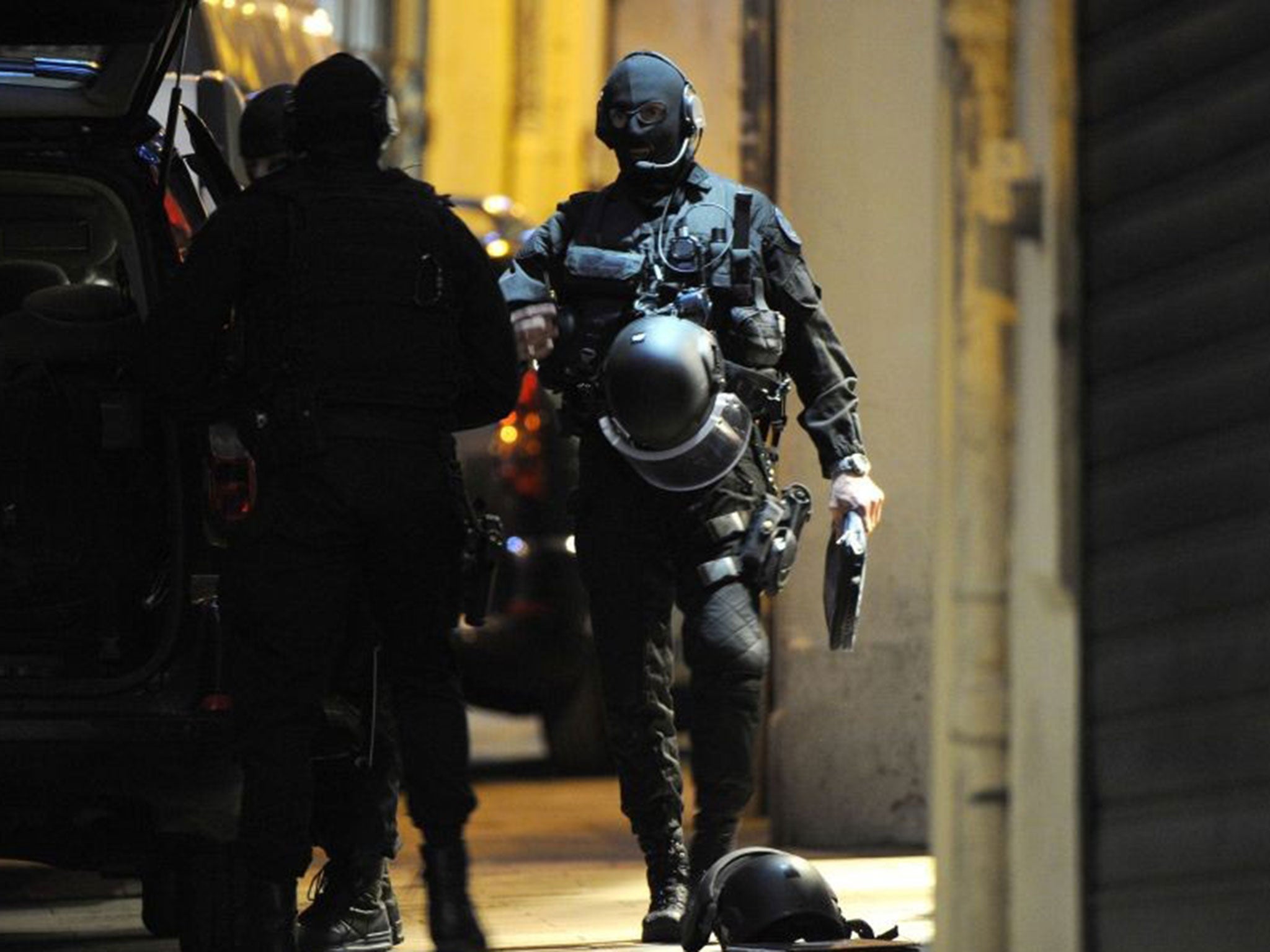 French police special forces arrive near a jewellery store where two people were being held hostage by a gunman attempting a robbery on 9 January