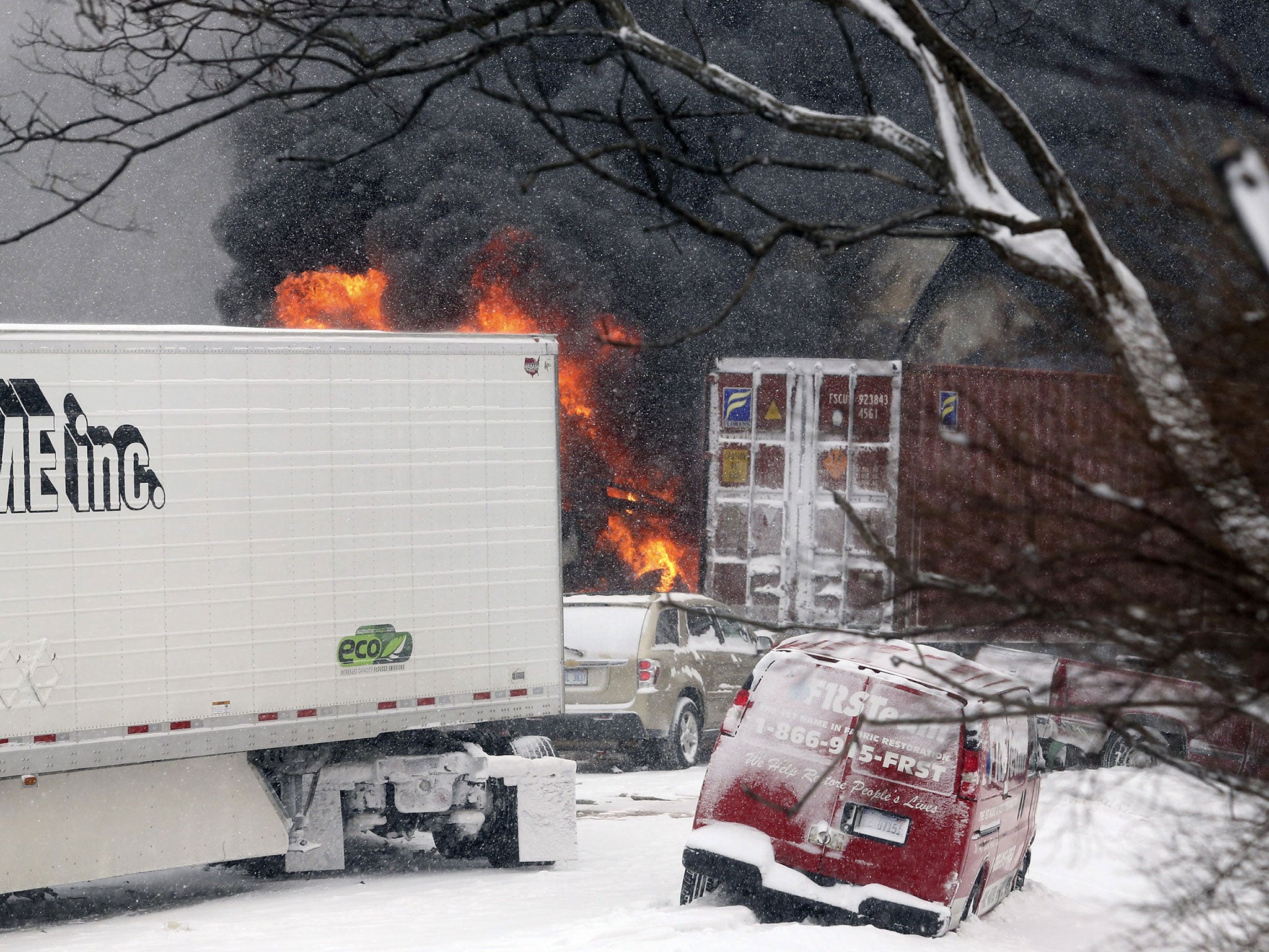 Vehicles burn at the scene of a fiery crash that closed both sides of Interstate 94, between mile markers 88 and 92 in eastern Kalamazoo County, near Galesburg, Mich.