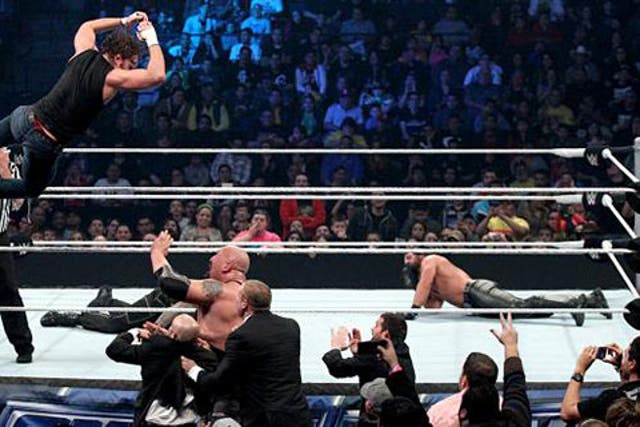 Dean Ambrose leaps to the outside on The Big Show, Kane and J&J Security