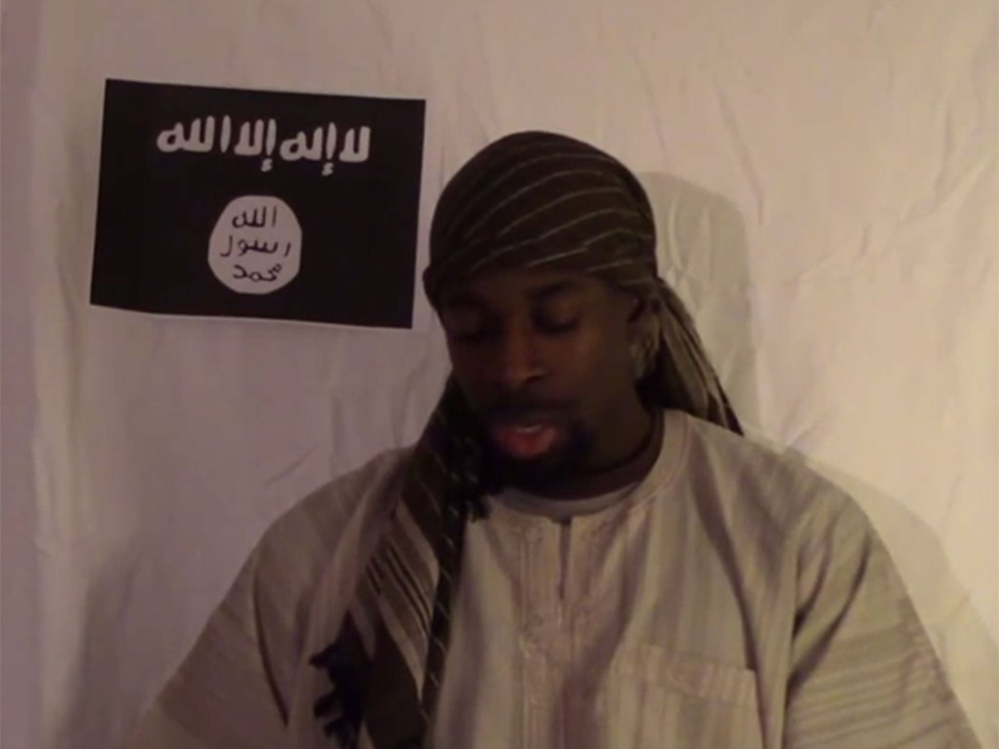 Coulibaly is purportedly shown reading from a piece of paper, pledging allegiance to Isis