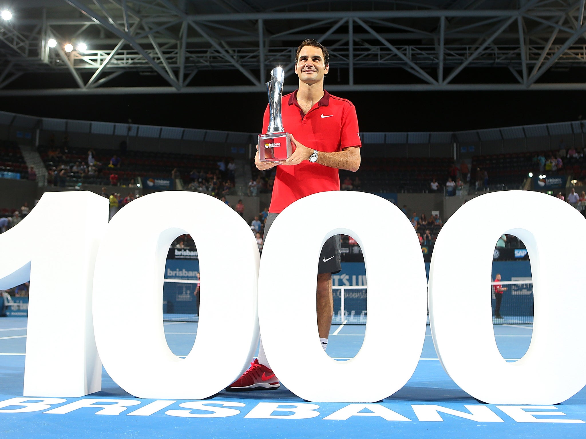 Roger Federer celebrates after claiming his 1,000th career win