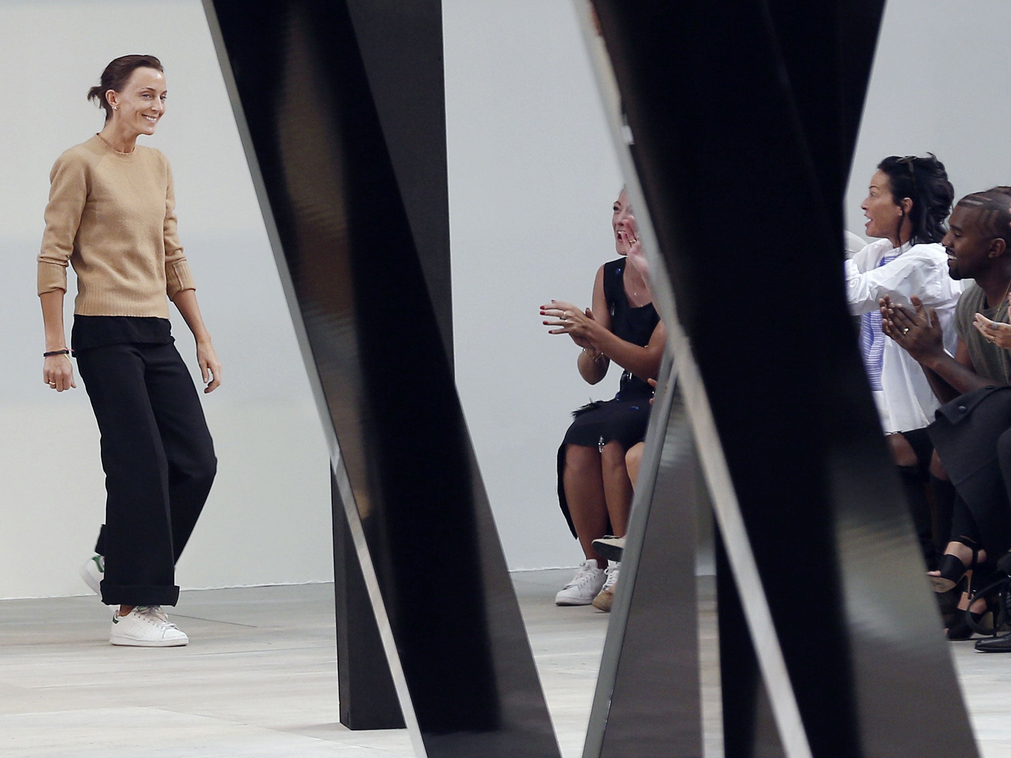 Phoebe Philo acknowledges the audience at the end of the Celine 2015 Spring/Summer ready-to-wear collection fashion show