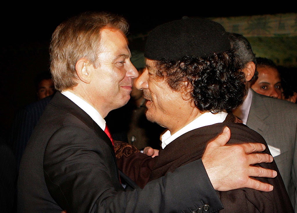 Prime Minister Tony Blair embraces Colonel Moammar Gadhafi after a meeting on May 29, 2007 in Sirte, Libya