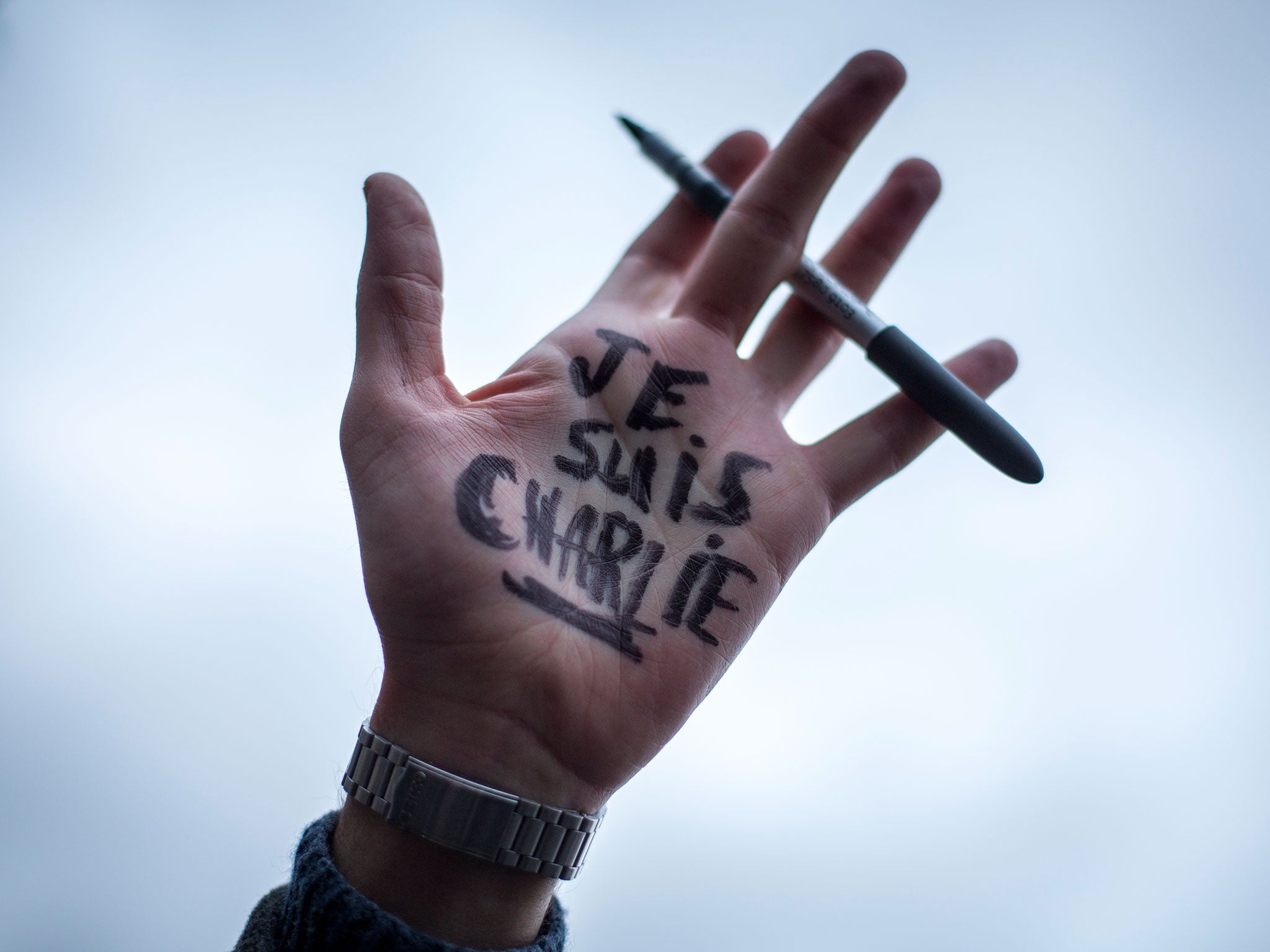 'Je Suis Charlie' written on the hand of a protester at the Paris anti-terrorism demonstration
