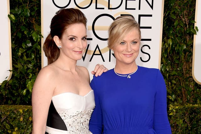 Tina Fey and Amy Poehler arrive to host the Golden Globes 2015