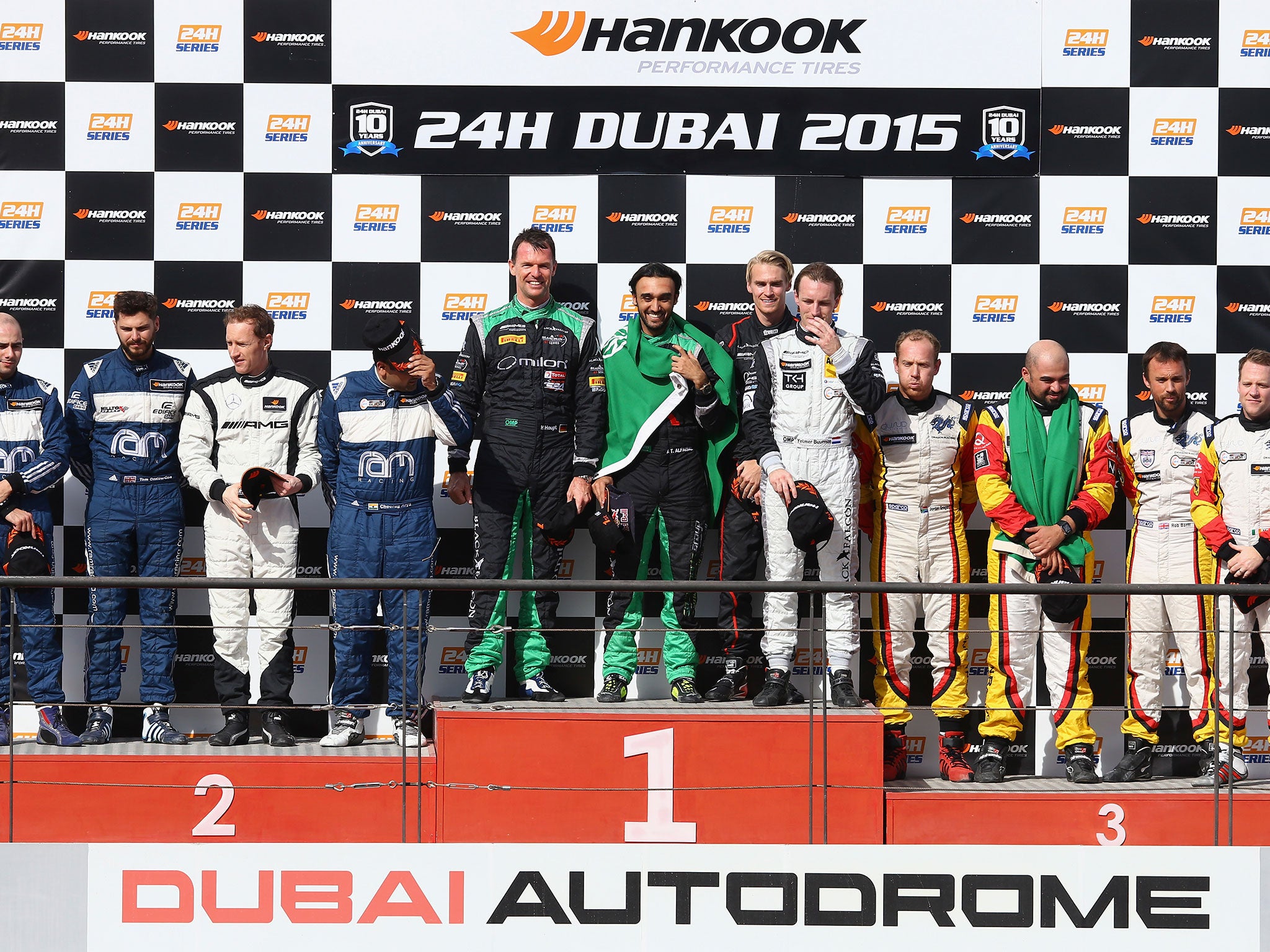 The #2 Black Falcon Mercedes SLS AMG GT3 team of Abdulaziz Al Faisal of Saudi Arabia, Hubert Haupt of Germany, Yelmer Buurman of the Netherlands and Oliver Webb of England celebrate on the podium after finishing first during the Hankook 24 Hours Dubai Ra