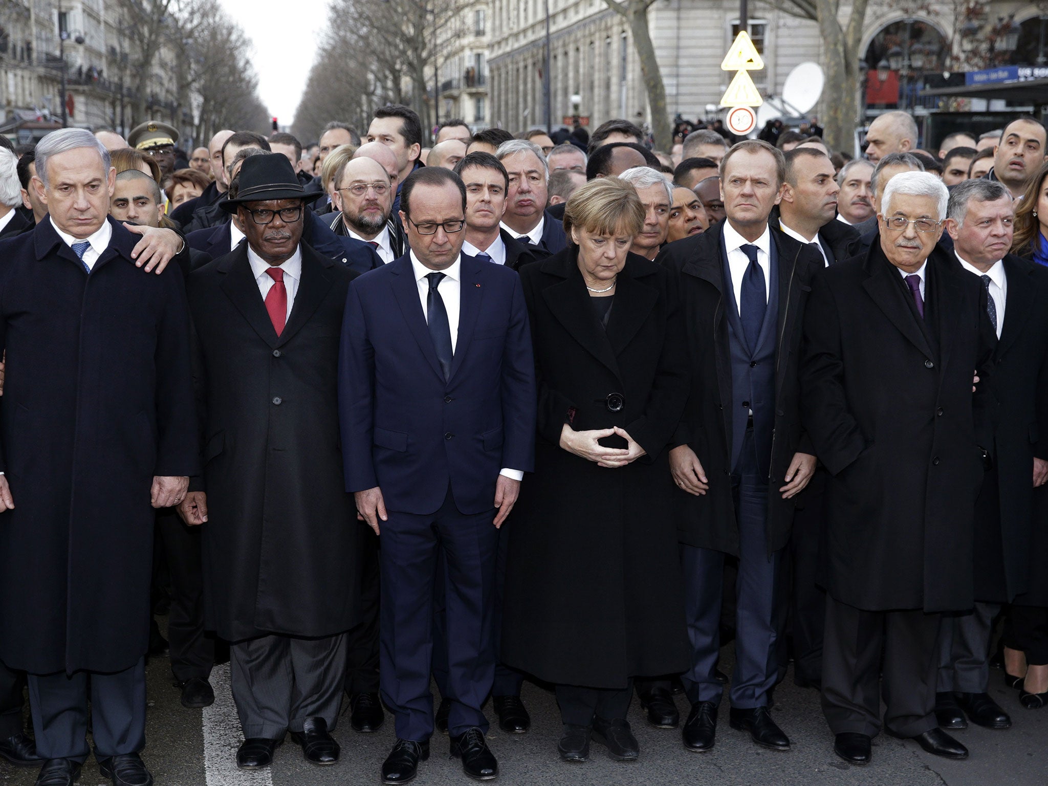 French President Francois Hollande observes a minute of silence surrounded by heads of state including (LtoR) Israel's Prime Minister Benjamin Netanyahu, Mali's President Ibrahim Boubacar Keita, Germany's Chancellor Angela Merkel, European Council Preside