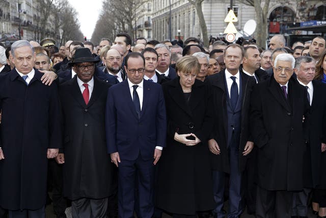 French President Francois Hollande observes a minute of silence surrounded by heads of state including (LtoR) Israel's Prime Minister Benjamin Netanyahu, Mali's President Ibrahim Boubacar Keita, Germany's Chancellor Angela Merkel, European Council Preside