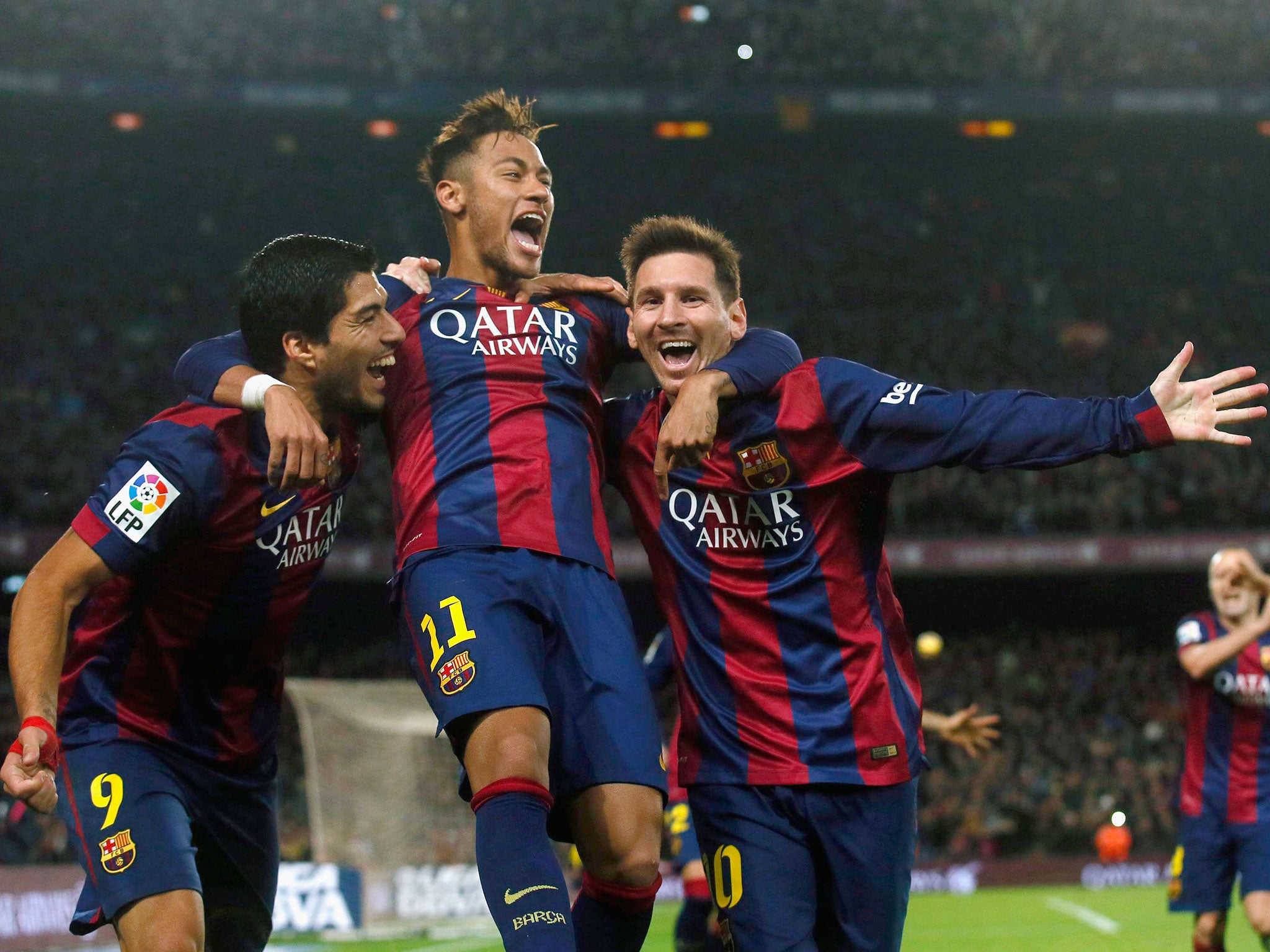 (L-R) Barcelona's Luis Suarez, Neymar and Lionel Messi celebrate a goal against Atletico Madrid during their Spanish First Division soccer match at Camp Nou stadium in Barcelona