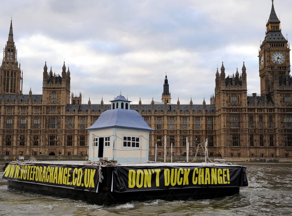 A 10ft high duck house sails down the Thames in protest to the abuse of MP's expenses in London in November, 2009. It was in reference to the £1,645 in expenses claimed by Sir Peter Viggers (Corbis)