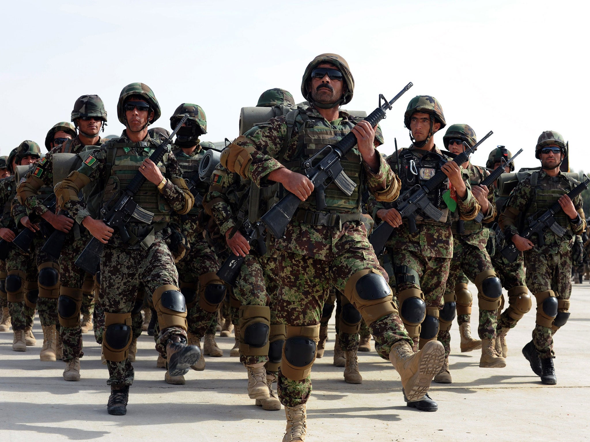 Afghan National Army soldiers march during a handover ceremony of NATO's International Security Assistance Force (ISAF) in Kandahar province on January 11, 2015