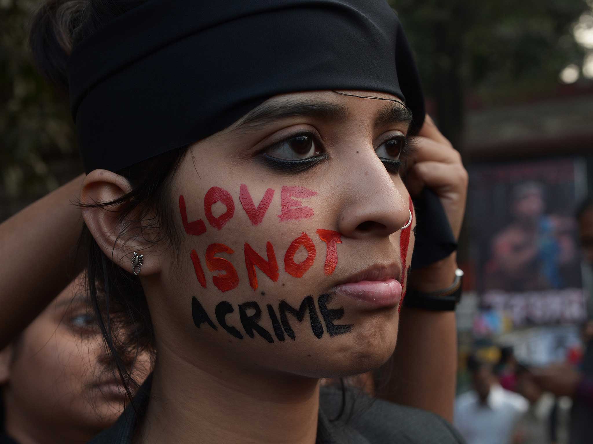 An Indian gay-rights activist takes part in a protest against the Supreme Court ruling reinstating a ban on gay sex in Kolkata on 11 December, 2013