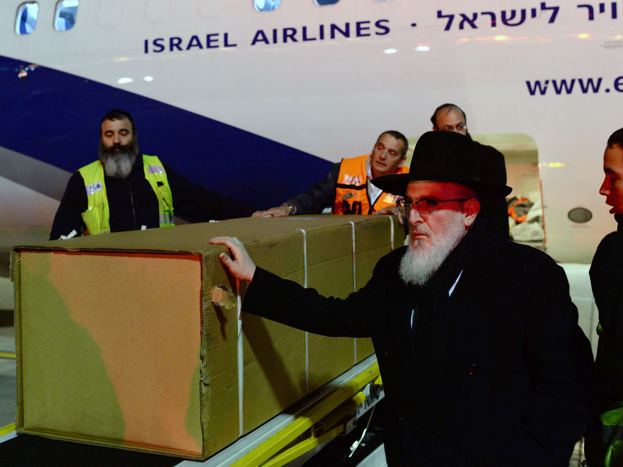 Coffins of the four Jewish terror victims who were killed during a hostage standoff at a kosher supermarket in Paris arrive at Ben Gurion airport in Tel Aviv