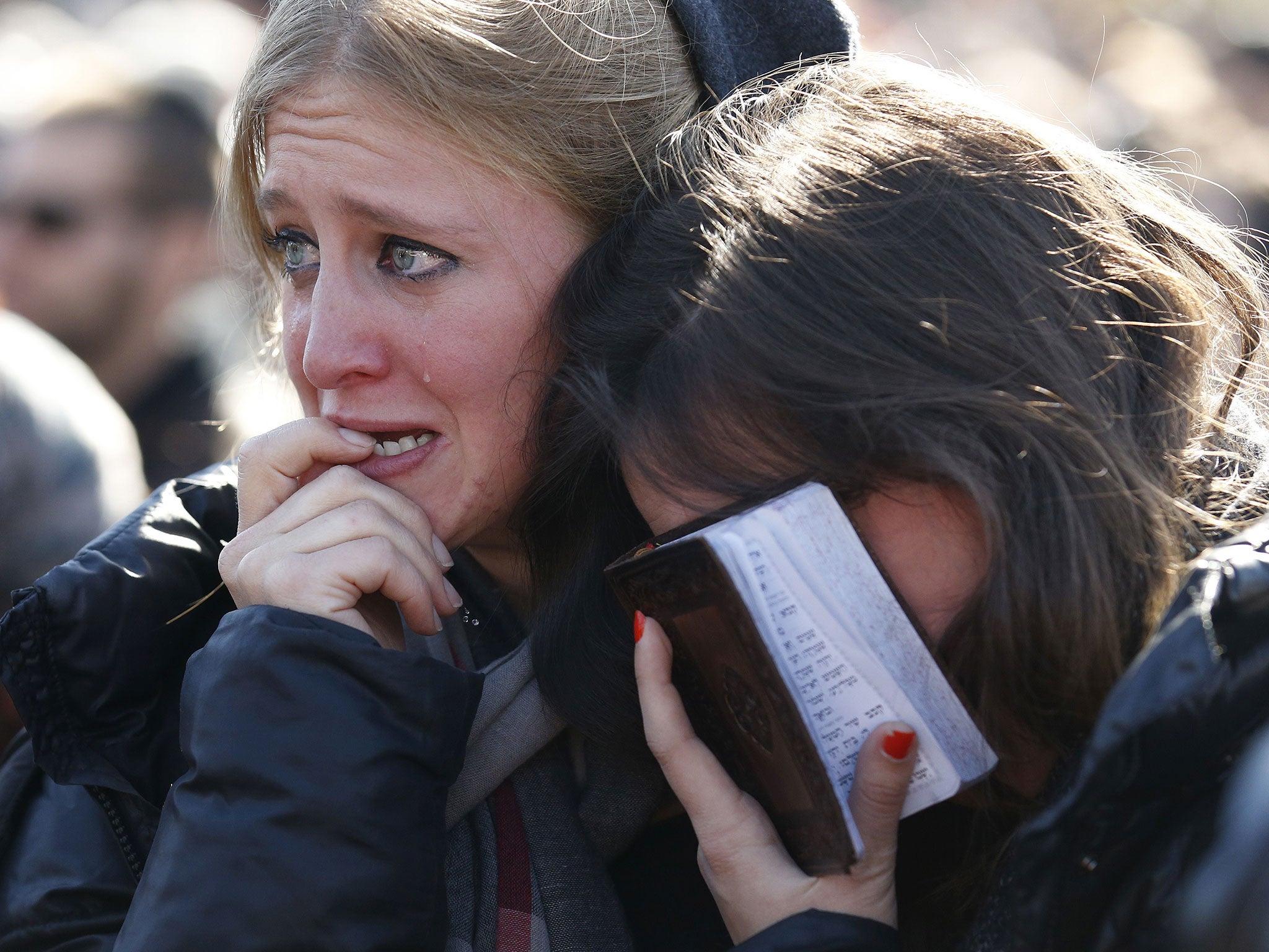 Mourners react in Jerusalem during the funeral of four Jews killed in an Islamist attack on a kosher supermarket in Paris