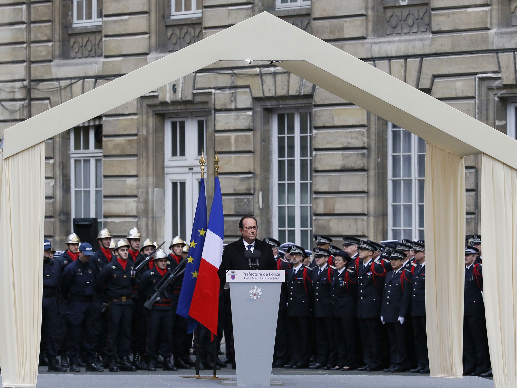French president Francois Hollande delivers a speech during a ceremony to posthumsly decorate the three Police officers with the Legion d'honneur at the Paris prefecture