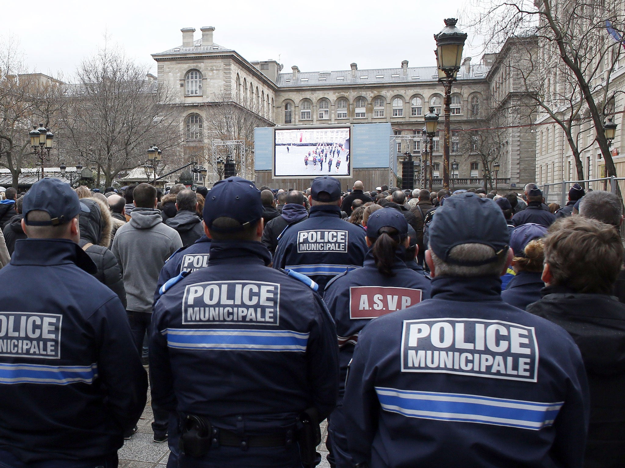 Policemen pay tribute to the police officers killed in the recent Islamist attacks