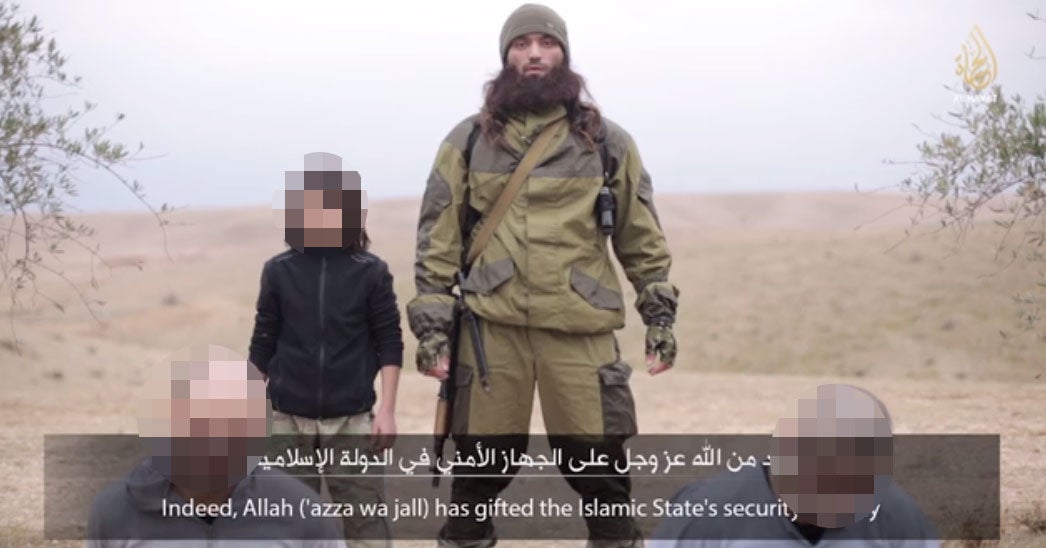 Video posted online by Isis propagandists appears to show the execution of what the group claims are two Russian spies by a young child