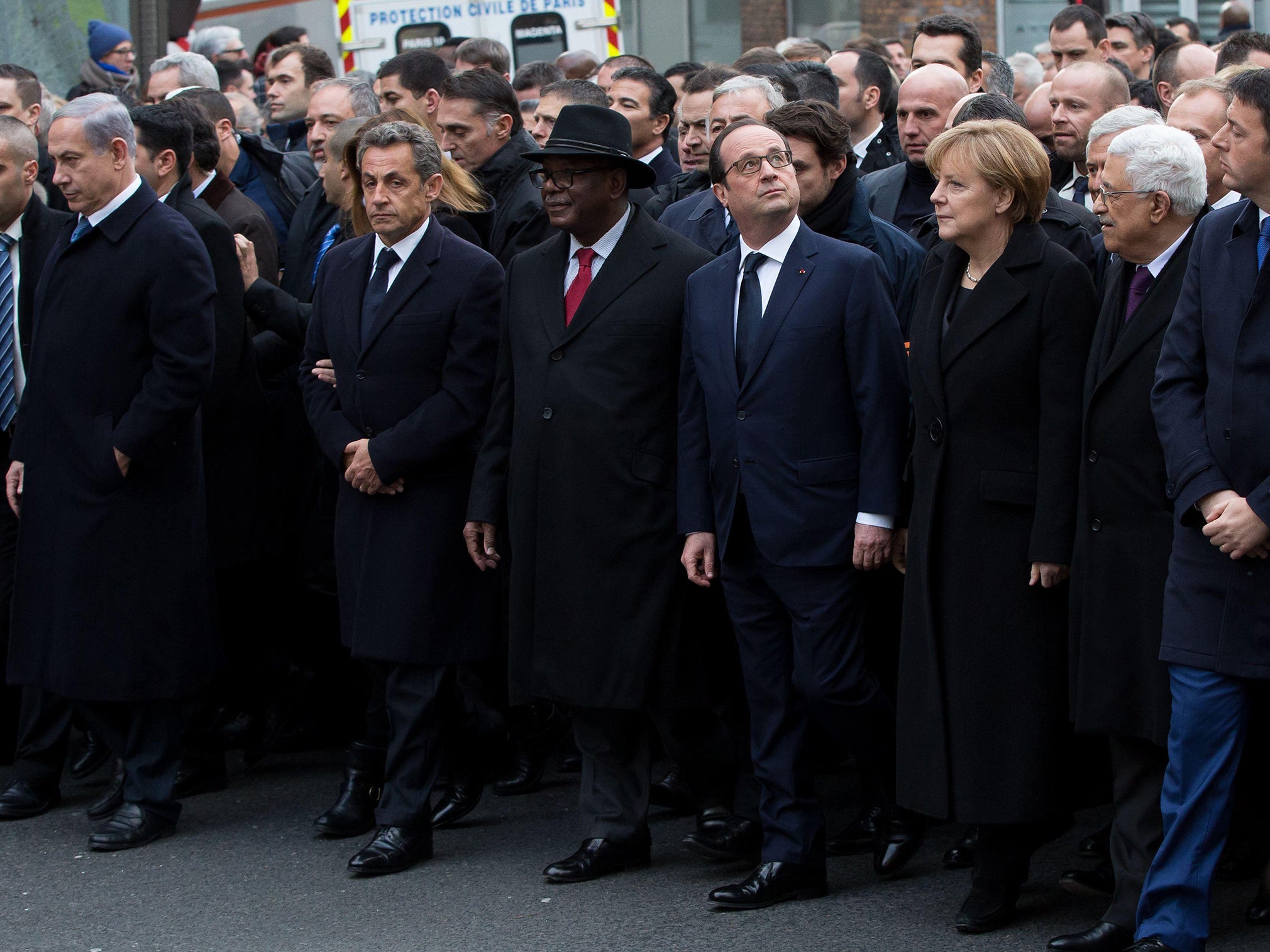 Former President Nicolas Sarkozy appeared to push his way to the front row of the Charlie Hebdo Paris rally