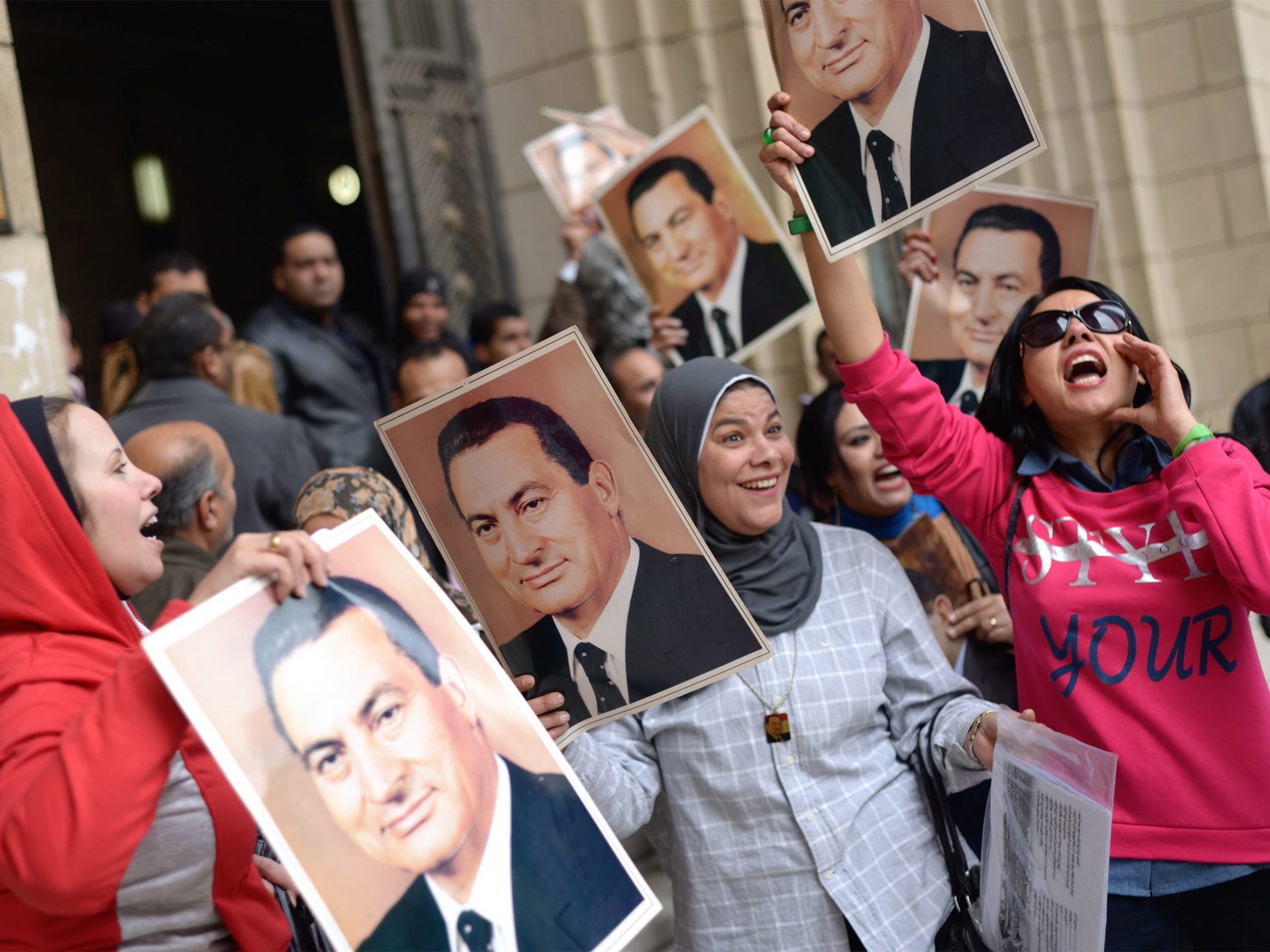 Supporters of Hosni Mubarak celebrate after a court in Cairo overturned his conviction in an embezzlement case