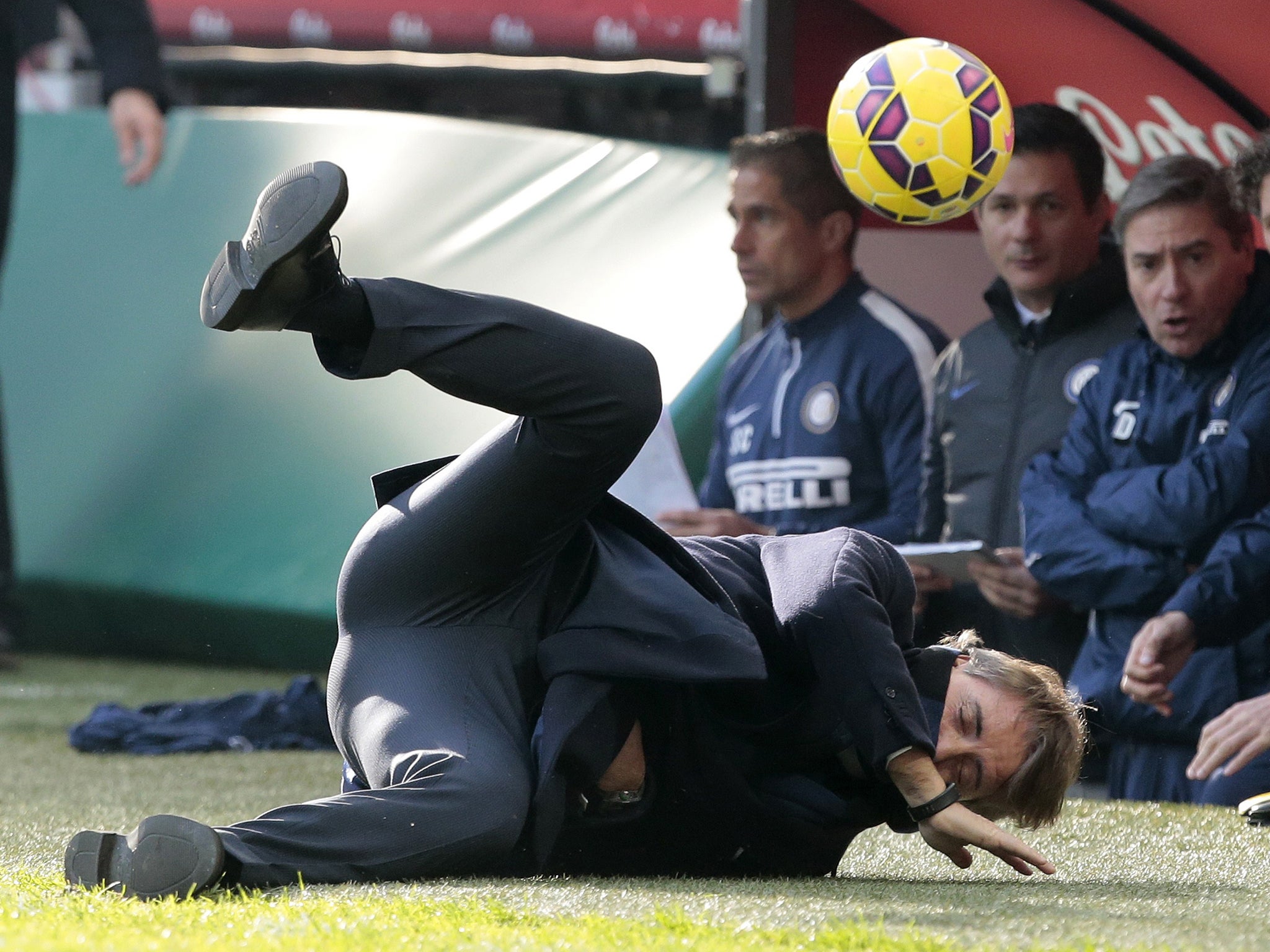 FC Internazionale Milano head coach Roberto Mancini hit by a ball.