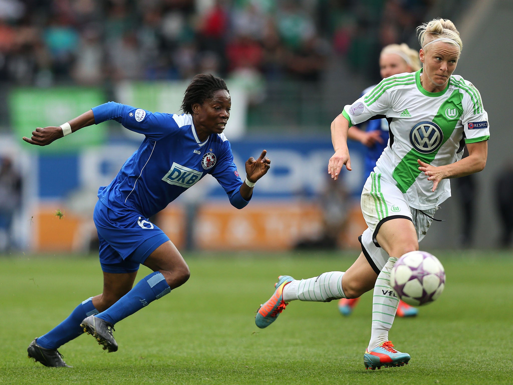 Genoveva Anonma (L) of Potsdam and Nilla Fischer of Wolfsburg vie for the ball during the second UEFA Women's Champions League semi final match