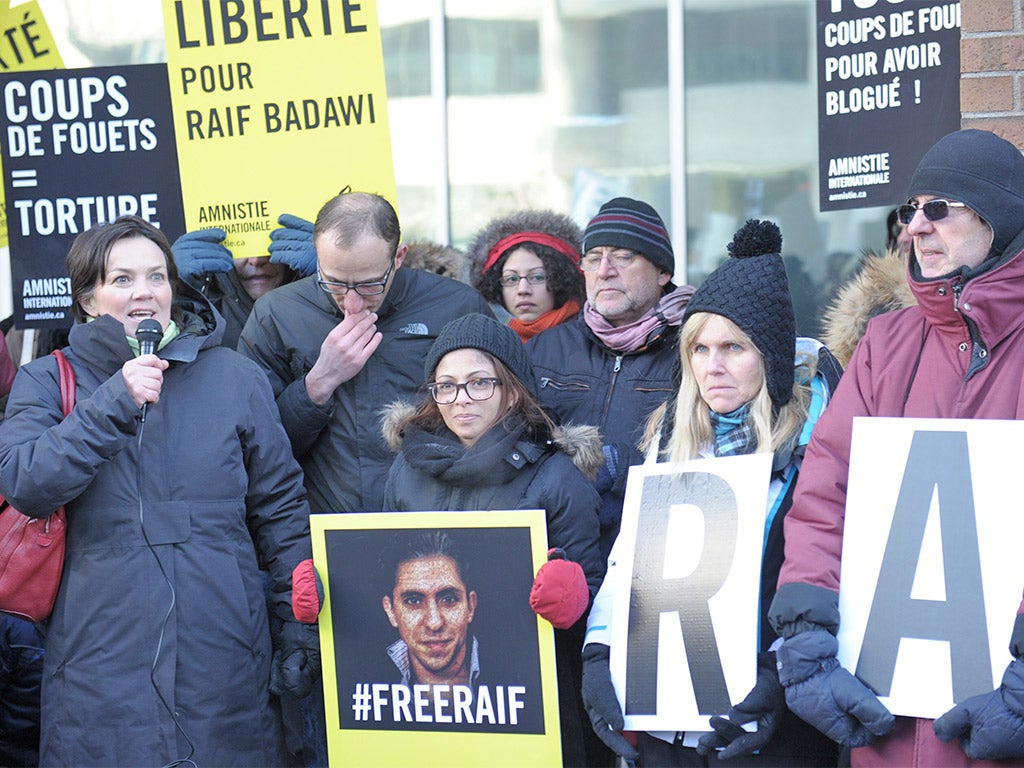 Ensaf Haidar, centre, wife of the Saudi blogger Raif Badawi, holds a vigil in Montreal, Quebec, urging Saudi Arabia to free her husband