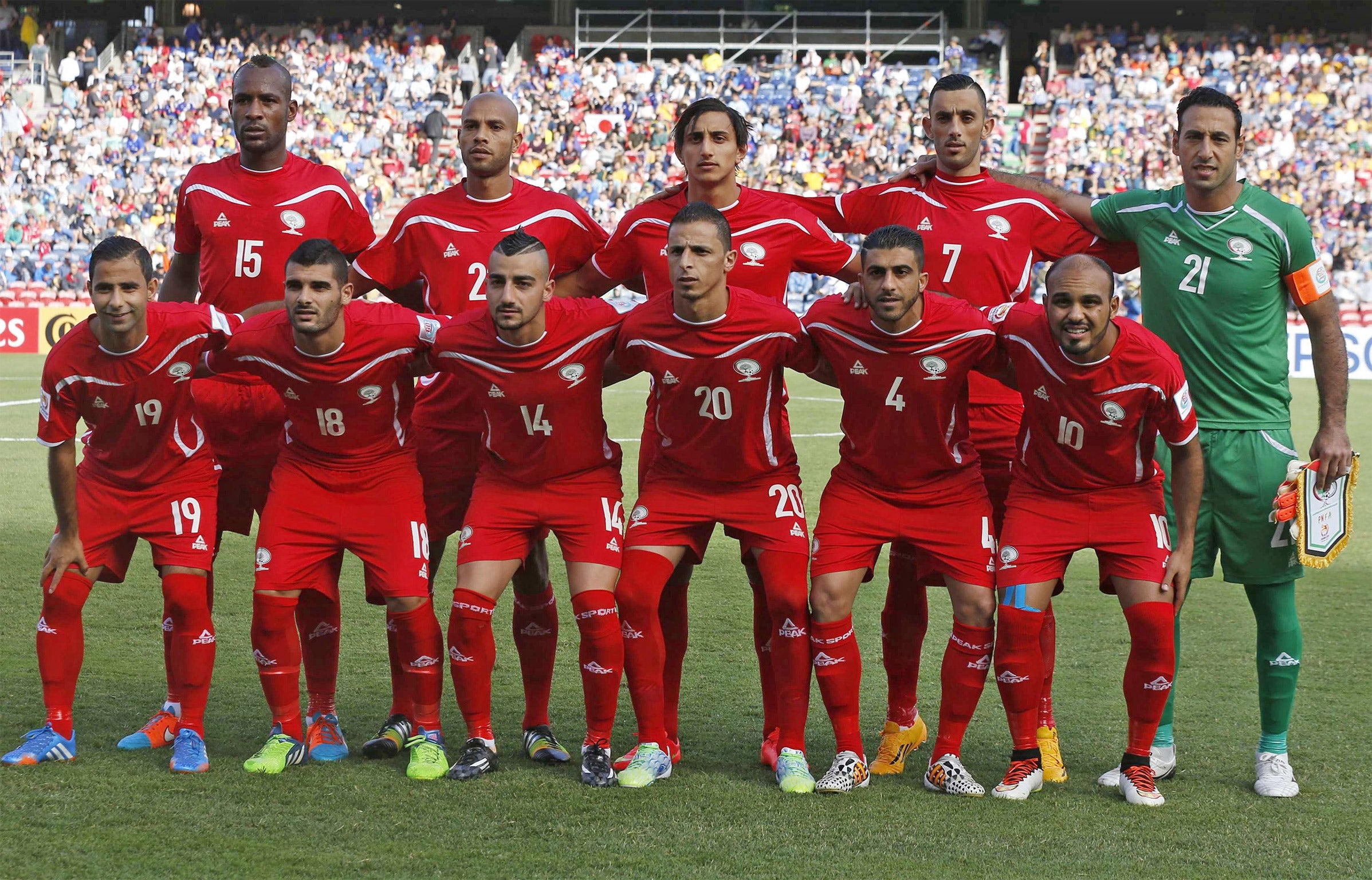 The Palestine team line up before their opening Asian Cup group match against Japan in Australia this week