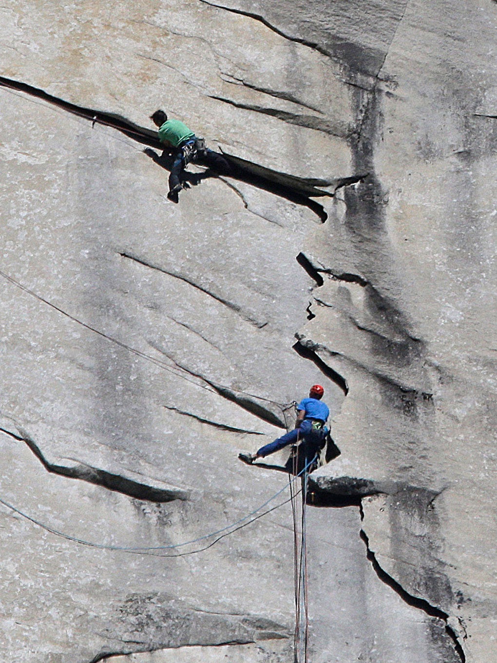 Kevin Jorgeson of California, wearing green, and 36-year-old Tommy Caldwell, wearing blue, near the summit of El Capitan
