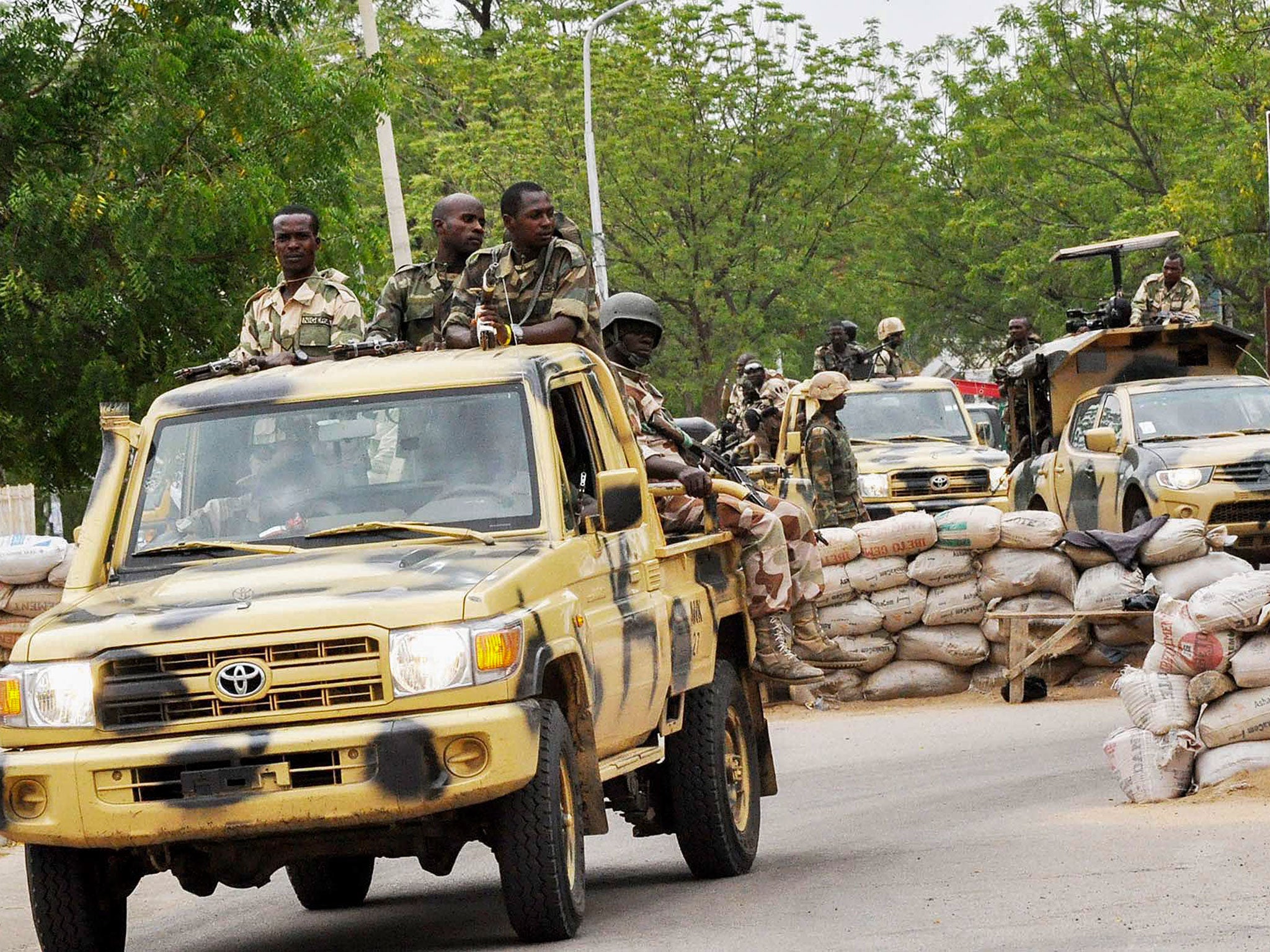 Members of the Nigerian military patrolling in Maiduguri, North East Nigeria, close to the scene of attacks by Boko Haram