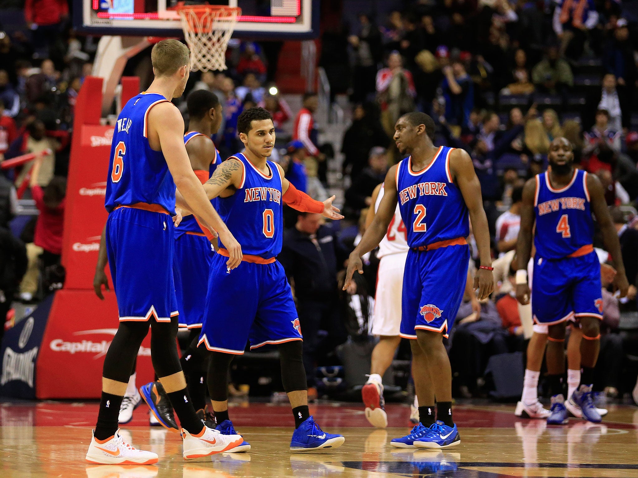 Shane Larkin talks with teammates Travis Wear and Langston Galloway