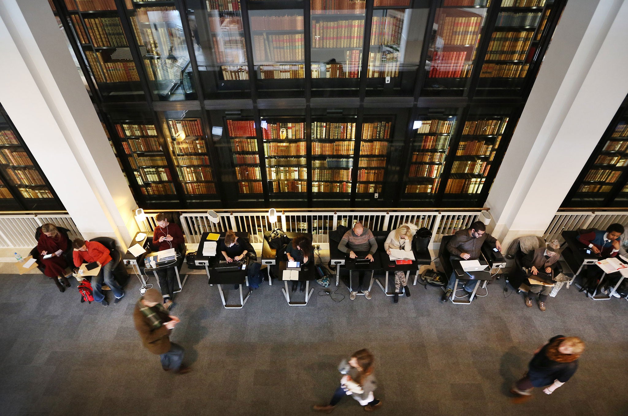 Visitors take advantage of free Wifi in the British Library foyer