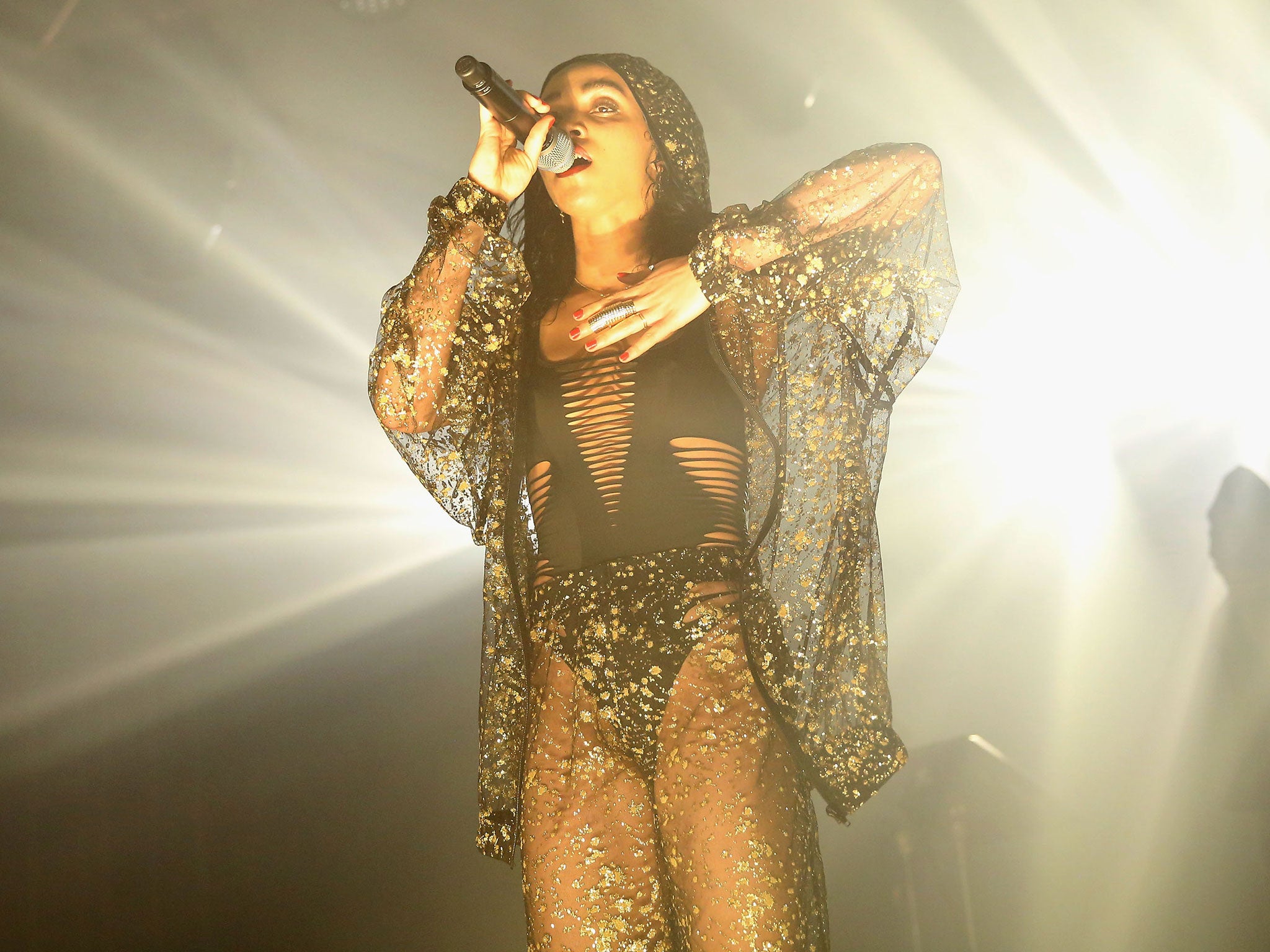 FKA Twigs performs on stage