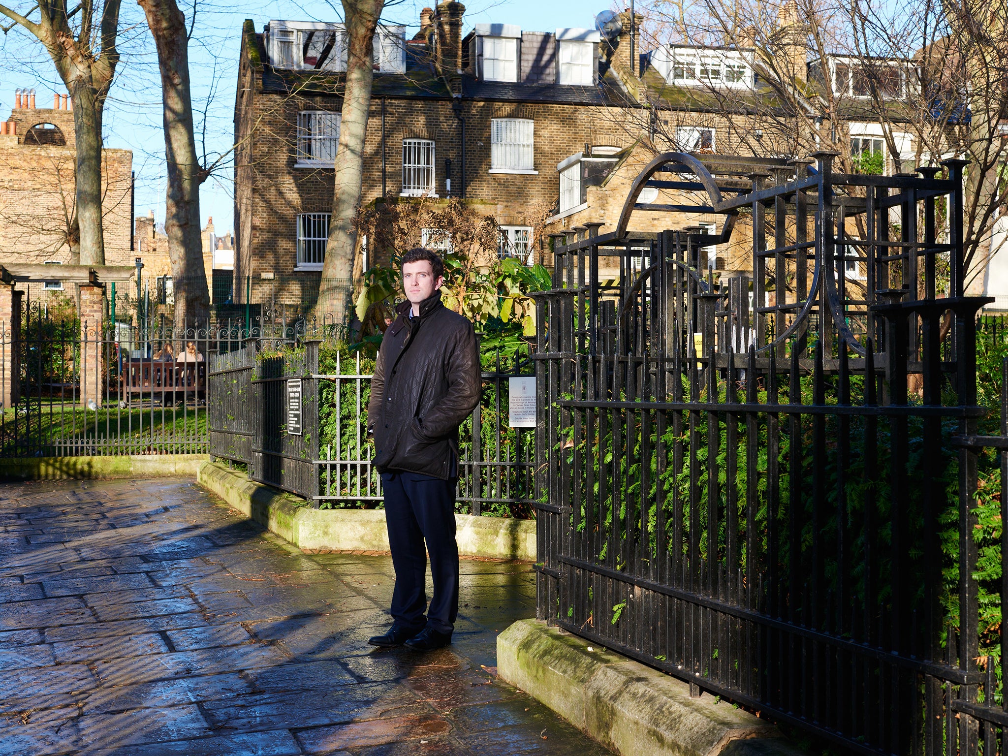 Ed Boord next to the park railings of a local park in Kensington where he found Pawel Koseda