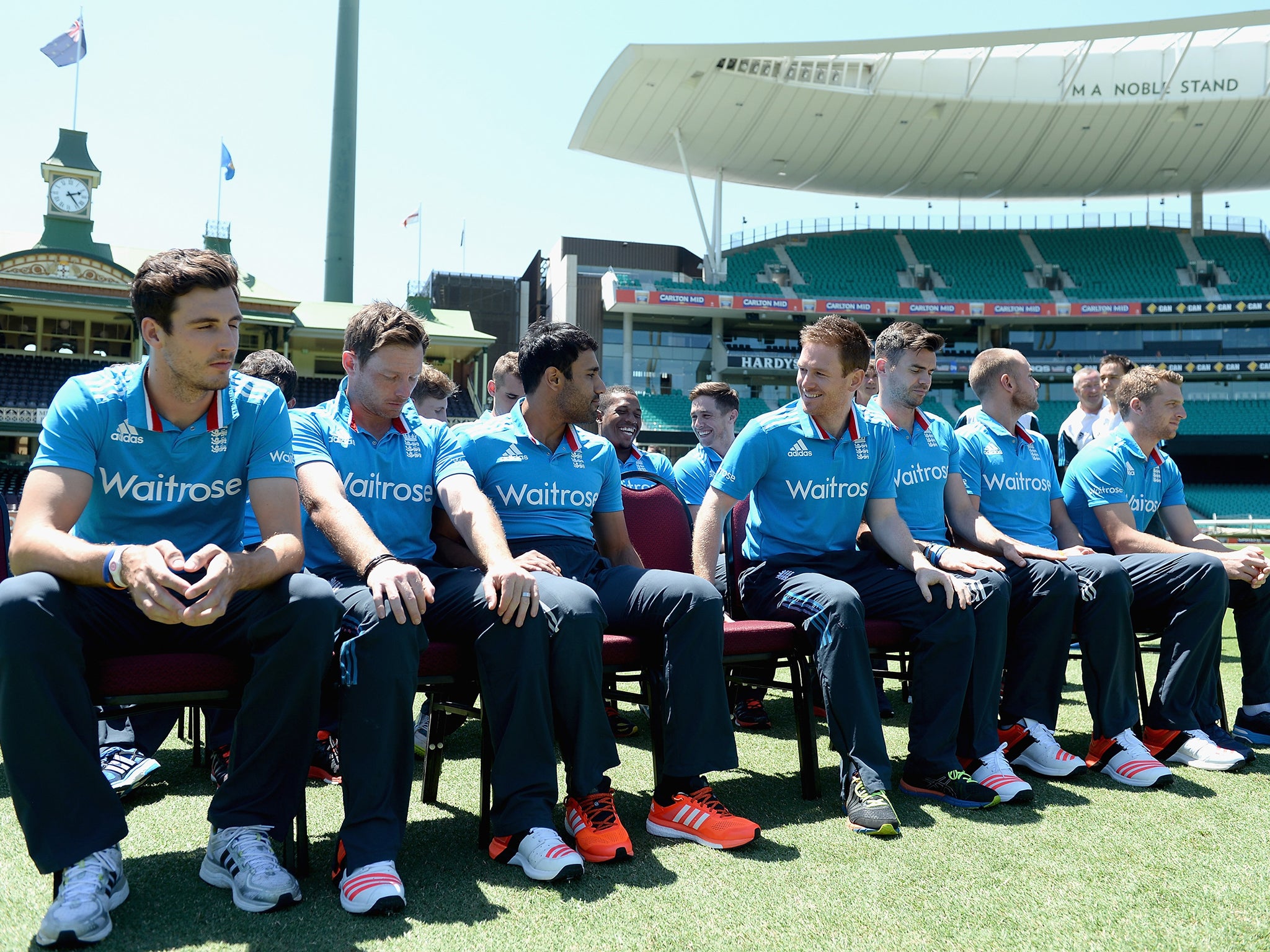England captain Eoin Morgan shares a joke with his team before posing for a team photo at the Sydney Cricket Ground