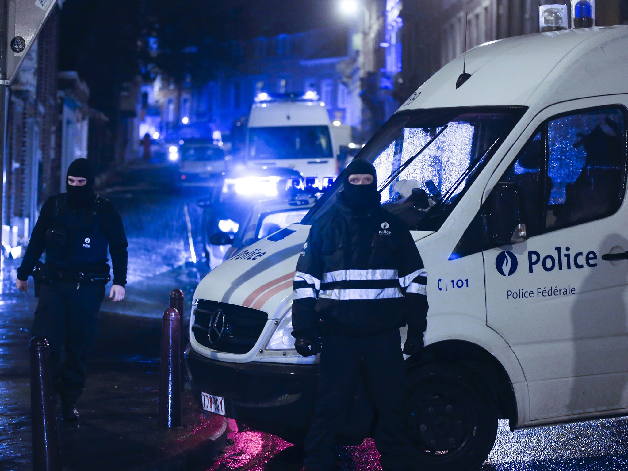 Police block the street of Colline in Verviers, 15 January 2014, after an anti terrorist operation