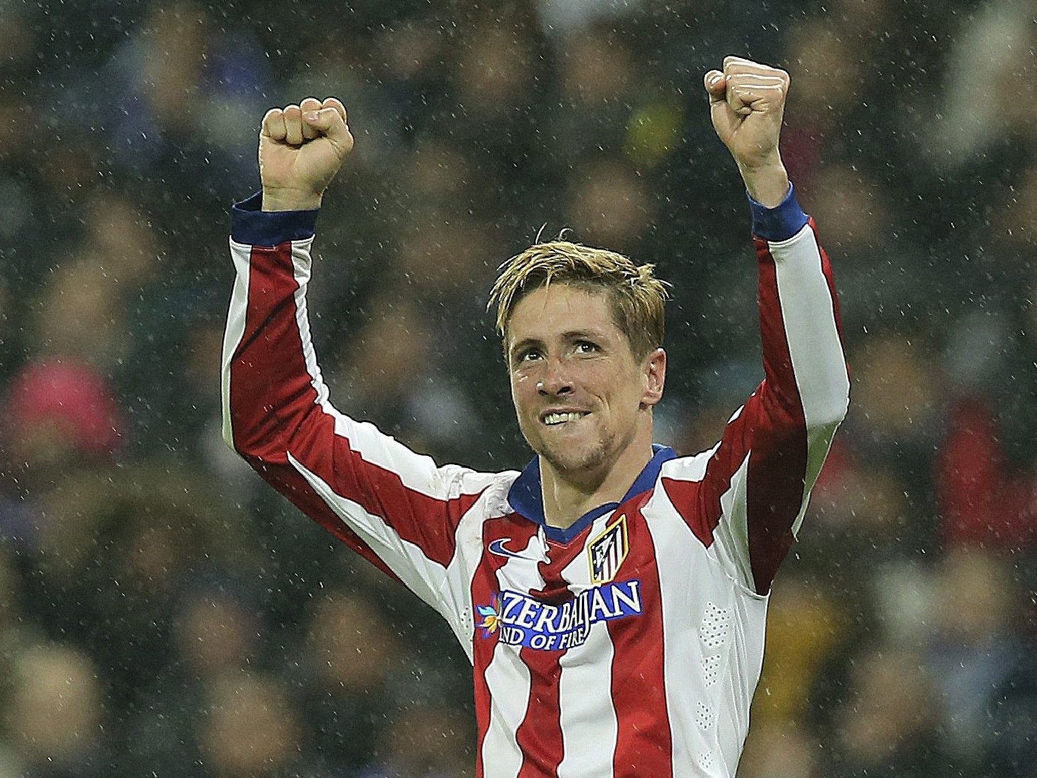 Fernando Torres celebrates his first goal since returning to Atletico
