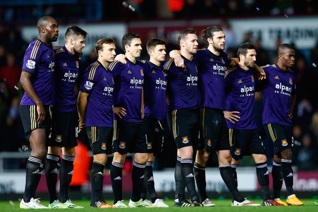 West Ham United players line up during a penalty shoot out in the FA Cup Third Round.