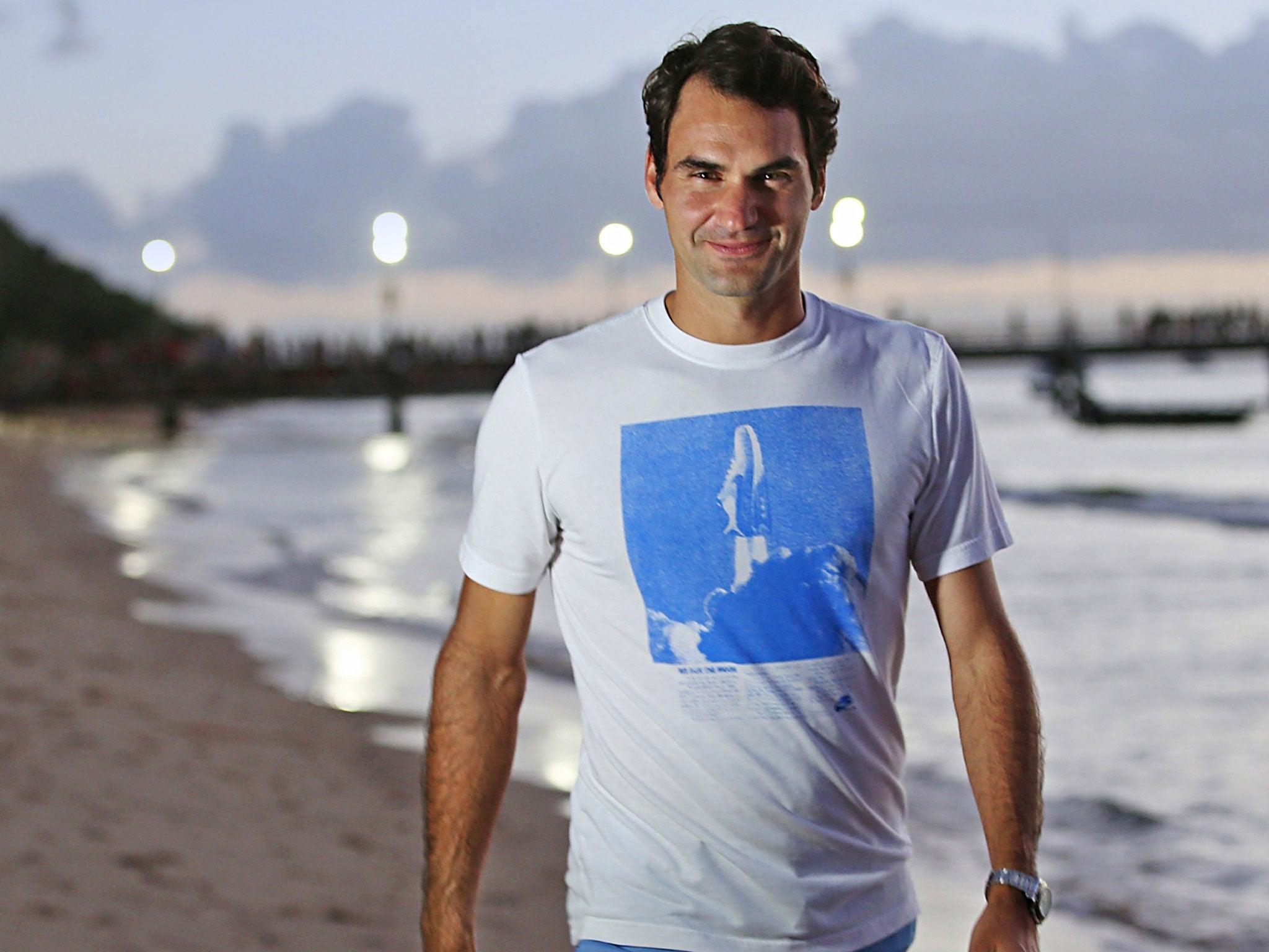 Roger Federer takes a stroll on the beach in the build-up to the Australian Open, which begins on Monday