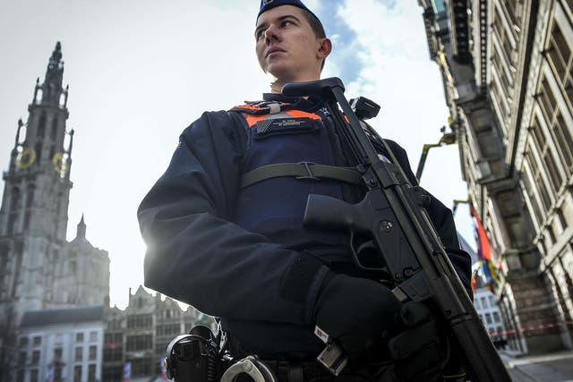 A police officer in front of Antwerp cathedral yesterday