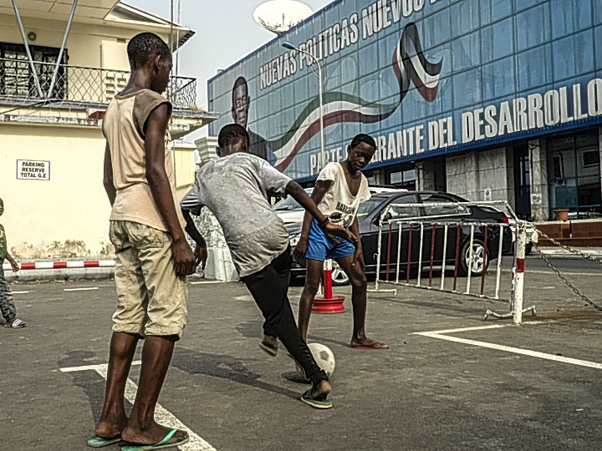 Children play football in the streets of Malabo