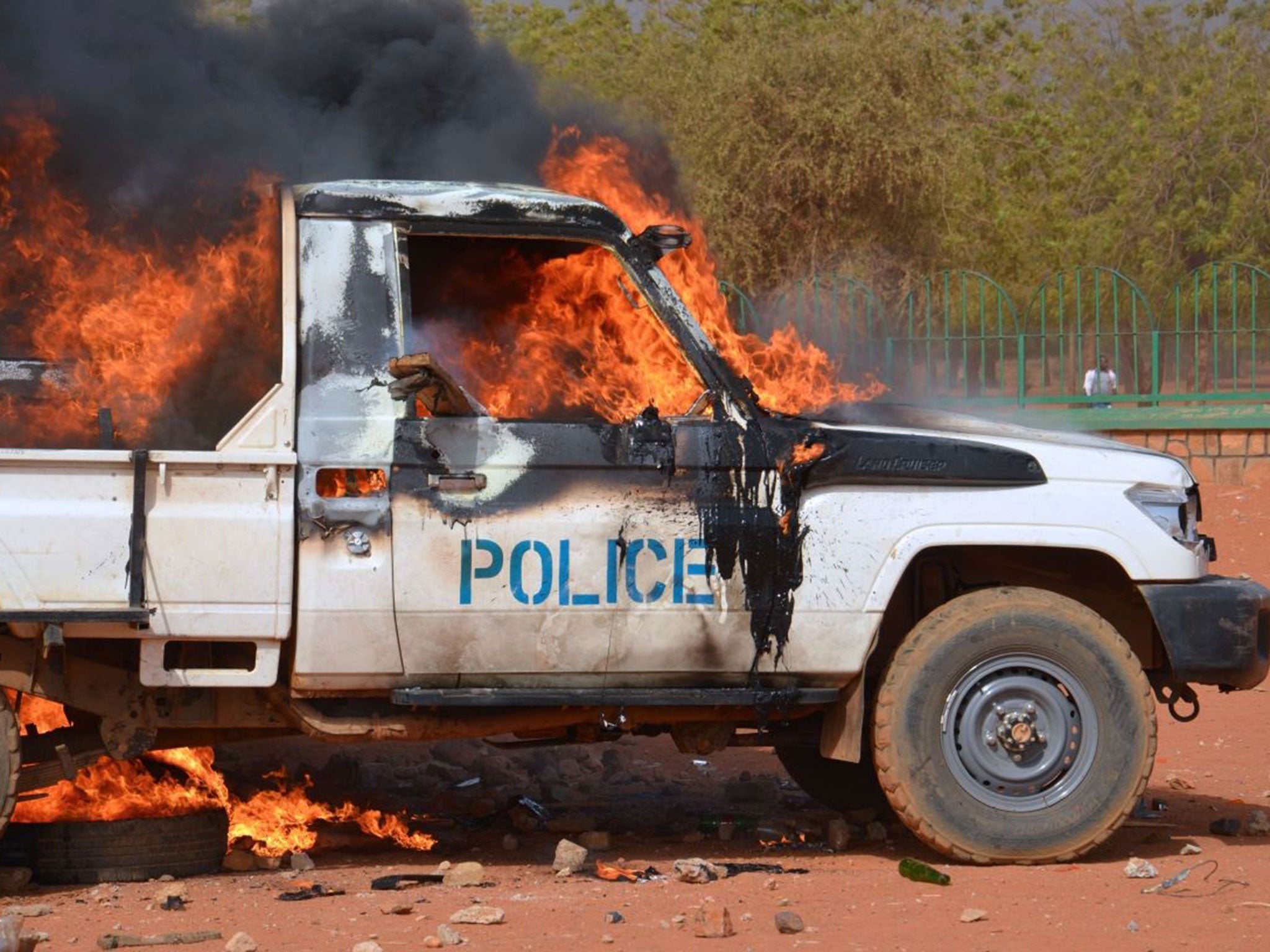 A police van set on fire by protesters during a demonstration against French weekly Charlie Hebdo's publication of a cartoon of the Prophet Mohammed in Niamey.